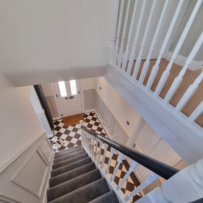 Handcrafted staircase joinery with wall panelling and turned spindles